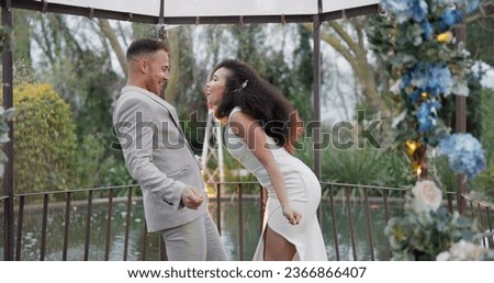 Wedding, fun dance and happy couple in garden with love, celebration and excited for future together. Gazebo, man and woman at marriage reception with flowers, music and happiness at party in nature.