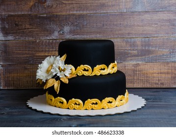 Wedding Gold And Black Cake And Cupcakes In Lace Wrappers