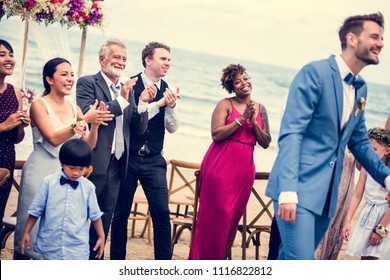 Wedding Guests Clapping For The Bride And Groom