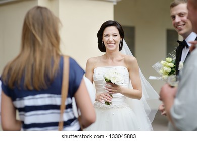 Wedding Guests Toasting Happy Bride And Groom