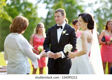 Wedding Guests Toasting Happy Bride And Groom