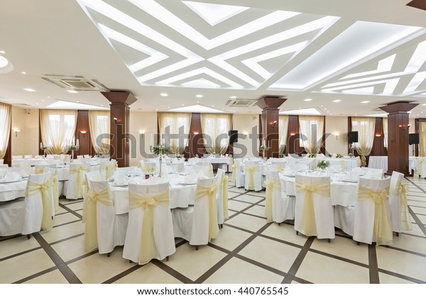 Wedding hall or other function facility set\
for fine dining\
\
