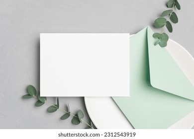 Wedding invitation card mockup with envelope and botanical decor, blank card mock up with copy space