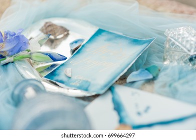 wedding invitation card, wax seal, vase, sea stone, flowers. Wedding, calligraphy vintage, top view. - Shutterstock ID 699664297