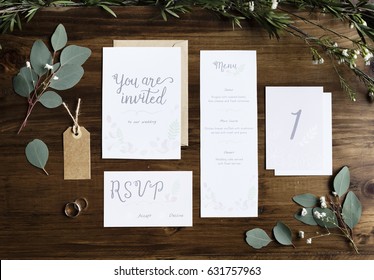 Wedding Invitation Cards Papers Laying on Table Decorate With Leaves - Shutterstock ID 631757963