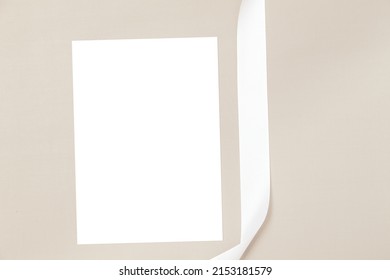 Wedding Invitation Or Greeting Card Mockup. Blank White Card 5x7 With White Satin Ribbon On A Beige Background.