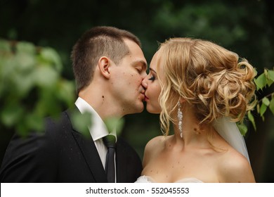 Wedding Kiss, Close-up Portrait Of Young Kissing Bride And Groom