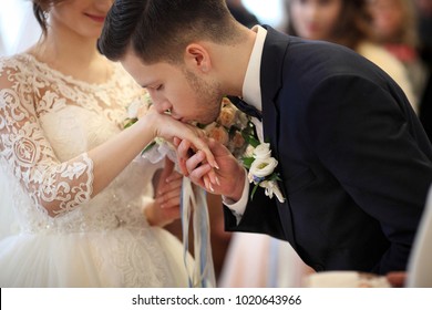 Wedding kiss. Groom kisses bride's hand. Weddng love