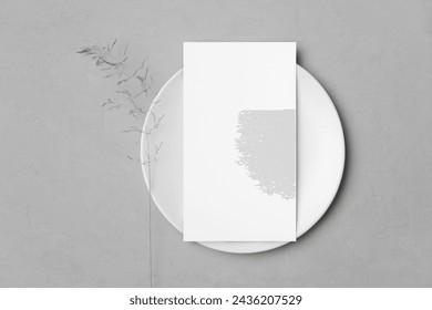 Wedding menu card mockup on white plate with botanical decoration, blank mock up with copy space for card design