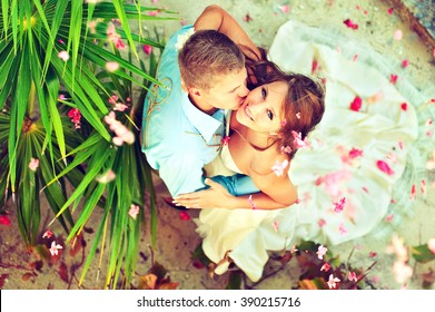 Wedding on the beach . Young beautiful couple get married on the beach on a tropical island . Happy newlyweds . Romantic beautiful wedding