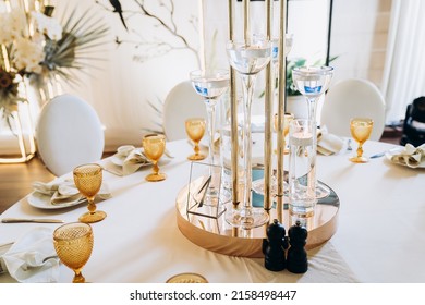 Wedding orchid tropical beige table and candle composition