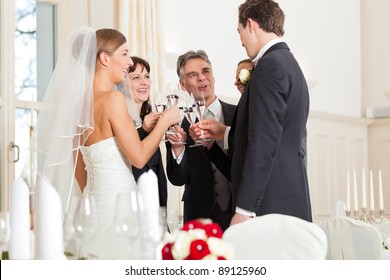 Wedding Party Bride, Groom And Bride Father Clinking Glasses With Sparkling Wine