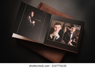 Wedding Photobooks In Brown Leather Binding With Photos Of The Newlyweds On The Cover. High-quality And Expensive Photo And Printing Products. Services Of A Professional Photographer And Designer.