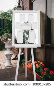 Wedding Photography: Classic Seating Chart  on a White Wooden Frame, copy space