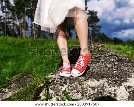 Wedding photos in red sneakers.