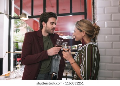 Wedding Planning. Adorable Gay Couple Carrying Glasses And Talking