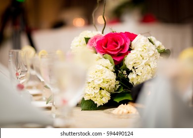 Wedding Reception Table Setting With Flower Centerpiece