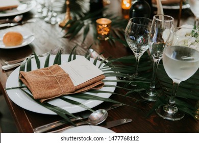 Wedding Reception Table Setting, Wedding Menu Card On Plate, Wrapped In Burlap And Twine With Palm Leaf