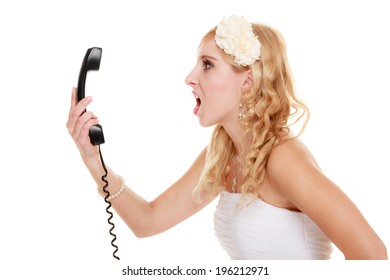 Wedding relationship difficulties. Angry woman talking on the phone. Fury bride screaming isolated on white.
