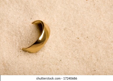 A Wedding Ring Buried In The Sand - Lost