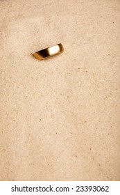 A Wedding Ring Buried In The Sand - Lost