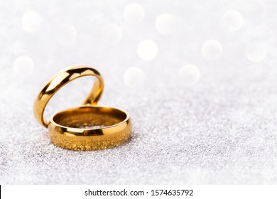 wedding ring celebration background with two gold rings