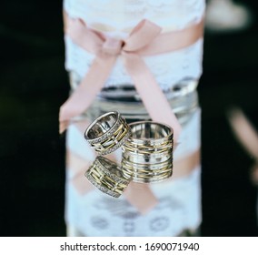 wedding ring wedding. on the reflective table
