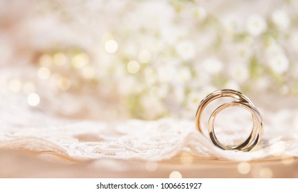 Wedding ring on the vintage lace - Shutterstock ID 1006651927