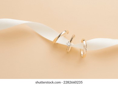 Wedding ring photography is an important part of a wedding photoshoot, capturing the elegance and significance of a couple's love and commitment. These close-up shots highlight the intricate details o - Shutterstock ID 2282660235