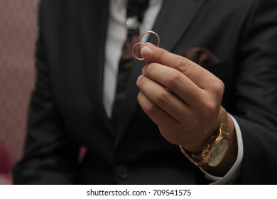 Wedding ring in your hand - Shutterstock ID 709541575