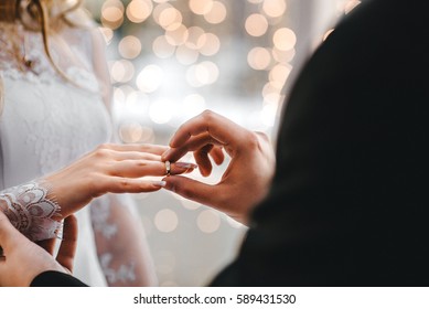 Wedding rings - Shutterstock ID 589431530