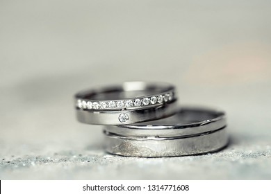 Wedding Rings Of Gold, Silver, Palladium Metal With Diamonds, Zircons And Gems