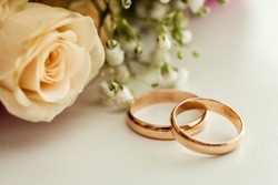 Wedding Rings Lie On A Beautiful Bouquet As Bridal Accessories