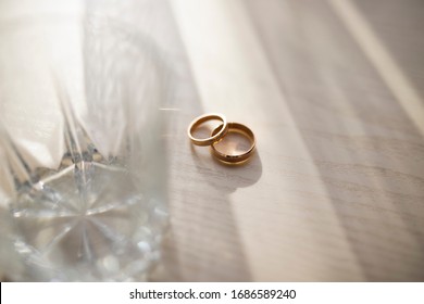 Wedding rings lie on the table