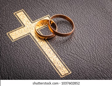 wedding rings on the bible