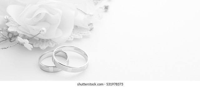 Wedding rings on wedding card on a white background, border design panoramic banner