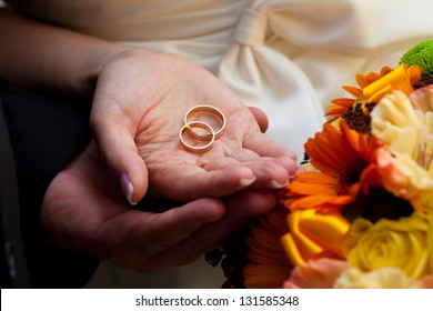 Wedding Rings On Hands Of Newlyweds. Wedding