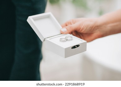Wedding rings. Putting on wedding rings.
 - Shutterstock ID 2291868919
