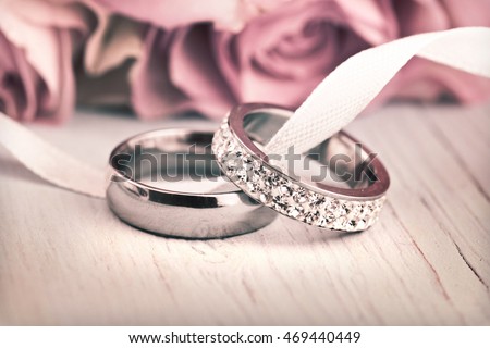 Wedding rings and roses.
