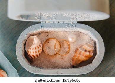 Wedding Rings In A Rustic Box With White Sand And Seashells, For The Wedding Ceremony Or Vow Renewal