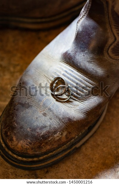 Wedding Rings Sitting On Cowboy Boot Stock Photo Edit Now 1450001216