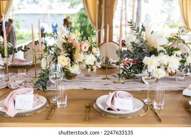 Wedding rustic table decor with peony and roses - Shutterstock ID 2247633135
