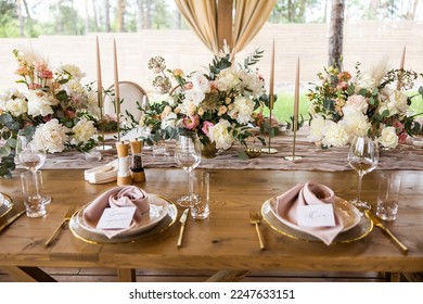 Wedding rustic table decor with peony and roses - Shutterstock ID 2247633151