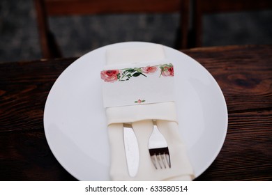 Wedding Seating Chart With Flowers On A Plate