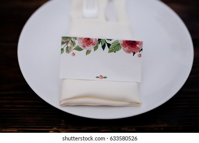 Wedding Seating Chart With Flowers On A Plate