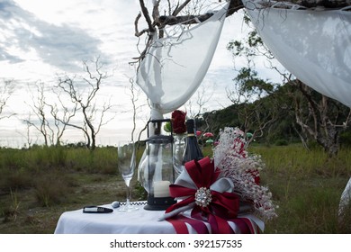 wedding setup in the forest at sunset sky