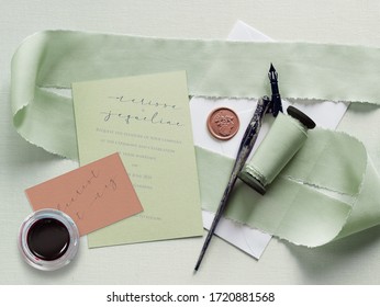 Wedding Stationary Mock Up For A Lesbian Couple. Pale Mint Green And Blush Color Palette. Letterpress And Calligraphy. Silk Ribbon And Wax Seal Details.