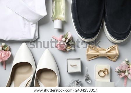 Wedding stuff. Flat lay composition with stylish boutonniere on light gray background