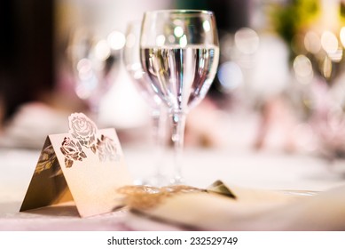 Wedding Table. Close-up Of Wine Glass And Name Card  