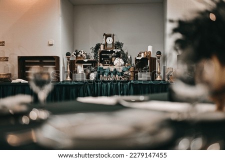 wedding table decoration, blurred foreground,greencolors,vintage,mrandmrs